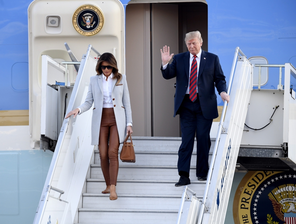 US President Donald Trump and First Lady Melania Trump disembark from Air Force One upon arrival at Helsinki-Vantaa Airport in Helsinki, on July 15, 2018 on the eve of a summit in Helsinki between the US President and his Russian counterpart. AFP / Lehtik