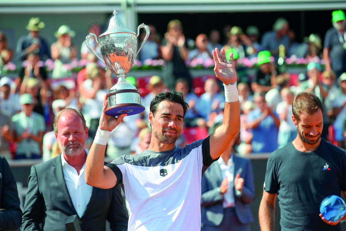 Fabio Fognini of Italy celebrates with the trophy after winning his final match against Richard Gasquet of France at the Swedish Open tennis tournament in Bastad, Sweden, on July 22, 2018. AFP / TT News Agency / Adam Ihse