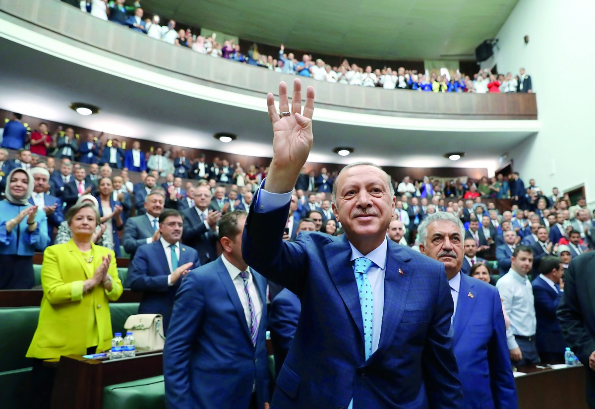 Turkish President Tayyip Erdogan greets parliamentarians from his ruling AK Party (AKP) during a meeting at the parliament in Ankara, Turkey July 24, 2018. Kayhan Ozer/Presidential Palace/Handout via Reuters