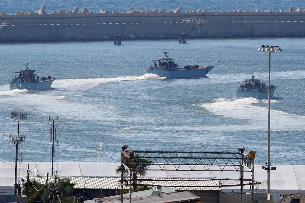 Israeli navy ships manoeuvre at the military port of Ashdod, southern Israel, on July 29, 2018. I AFP / Jack Guez   