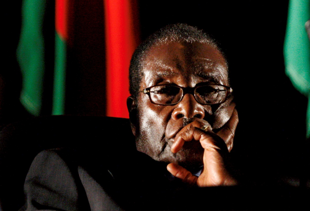 Robert Mugabe watches a video presentation during the summit of the Southern African Development Community in Johannesburg, August 17, 2008. (Reuters / Mike Hutchings) 