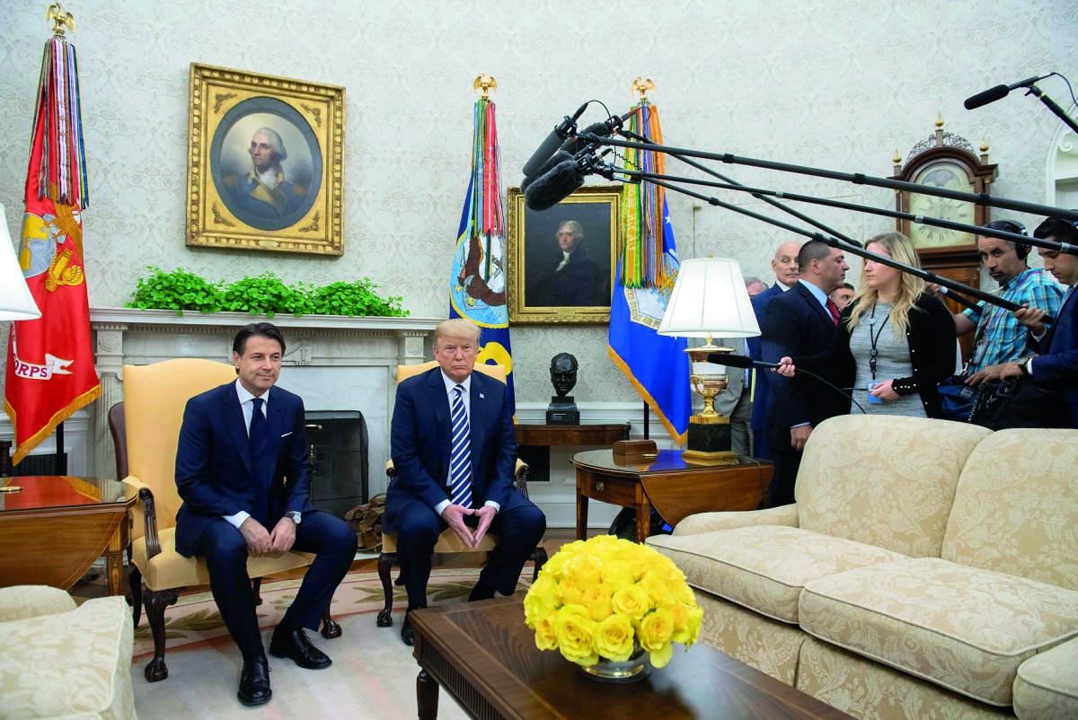 US President Donald Trump and Italian Prime Minister Giuseppe Conte hold a meeting in the Oval Office of the White House in Washington, DC, July 30, 2018.  AFP / Saul Loeb