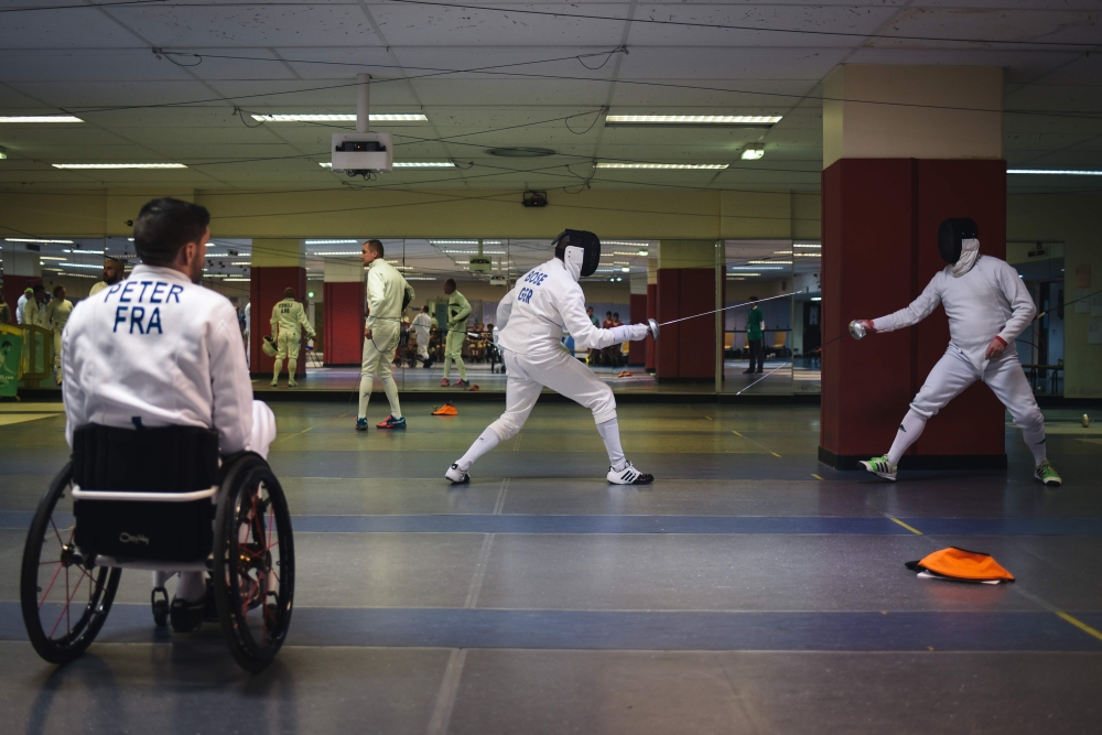 Athletes compete at the fencing event of the 2018 Gay Games at the Salle Armand Massard in Paris on August 5, 2018. AFP / Lucas Barioulet 