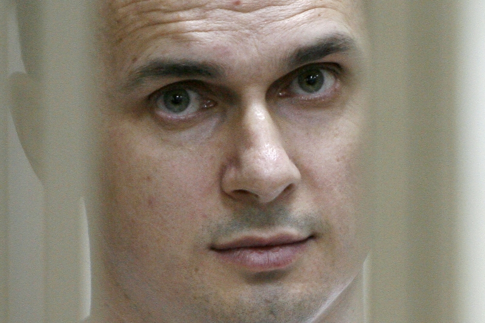 Ukrainian film director Oleg Sentsov looking on inside a defendants' cage during a hearing at a military court in the city of Rostov-on-Don on July 22, 2015. AFP / Sergei Venyavsky

