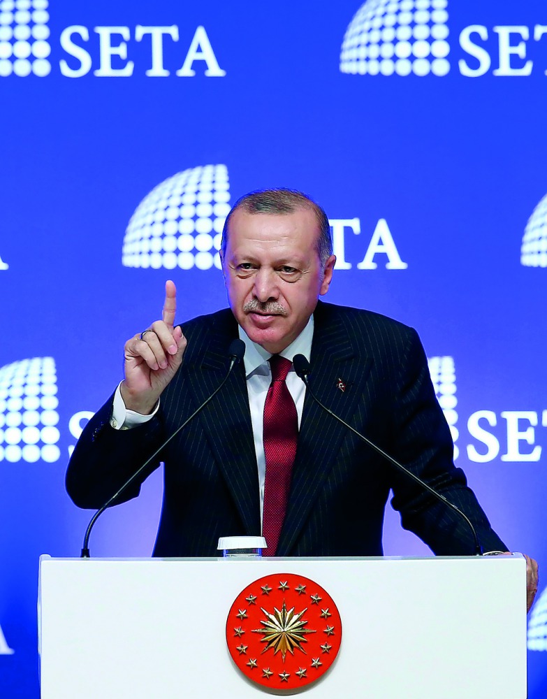 President of Turkey Recep Tayyip Erdogan gestures while addressing at a symposium organized by the Foundation for Political, Economic and Social Research (SETA) at the ATO Congresium Hall in Ankara, Turkey on August 14, 2018. ( Ra?it Aydo?an - Anadolu Age
