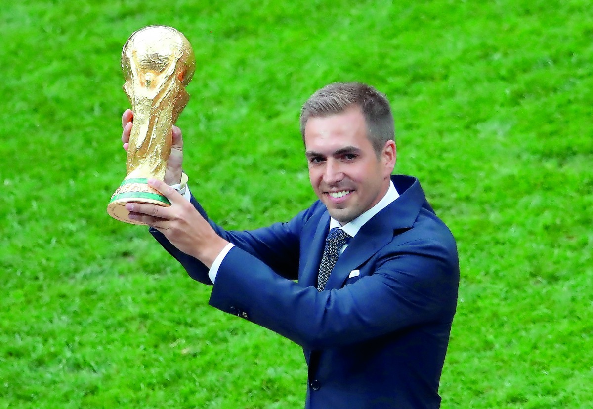 Former Germany player Philipp Lahm with the World Cup trophy at the Luzhniki Stadium, Moscow, Russia - July 15, 2018. Reuters/Maxim Shemetov