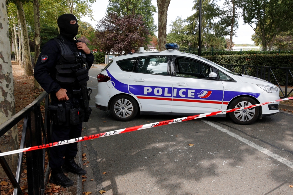 French police secure a street after a man killed two persons and injured an other in a knife attack in Trappes, near Paris, according to French authorities, France, August 23, 2018. REUTERS/Philippe Wojazer