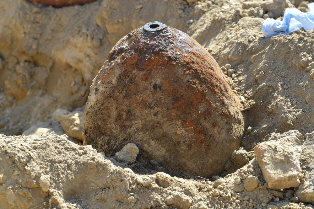 A World War II aerial bomb to be defused after it was found on a construction site in Ludwigshafen, western Germany, is pictured on August 26, 2018. Around 18,500 people had to leave their houses in an evacuation measure due to the bomb disposal. - German