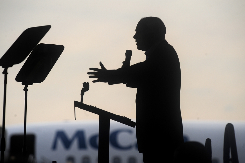 In this file photo taken on November 03, 2008 Republican presidential candidate Arizona Senator John McCain speaks at a campaign rally at the airport in Moon Township, Pennsylvania.  AFP / Robyn Beck 
