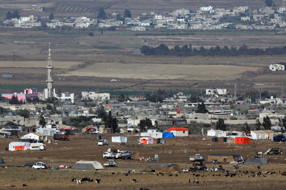 File photo of a general view shows refugee tents erected at the Syrian side of the Israeli-Syrian border as it is seen from the Israeli-occupied Golan Heights, Israel July 19, 2018. REUTERS/Amir Cohen -/File Photo