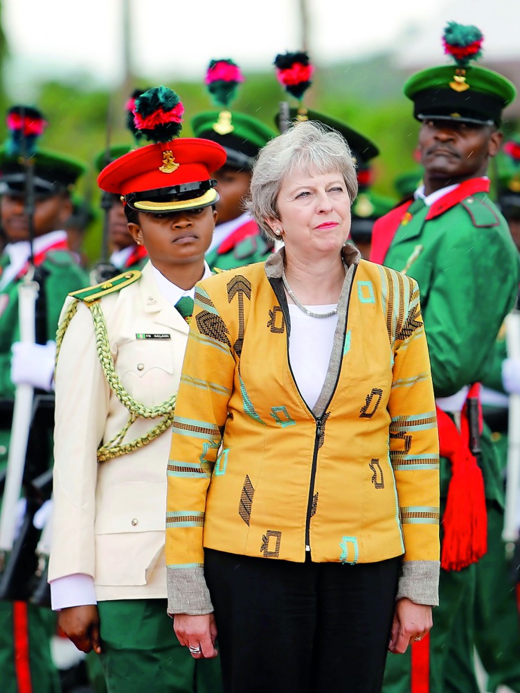 Britain's Prime Minister Theresa May inspects a guard of Honour as she arrives in Abuja, Nigeria, August 29, 2018. Reuters/Afolabi Sotunde