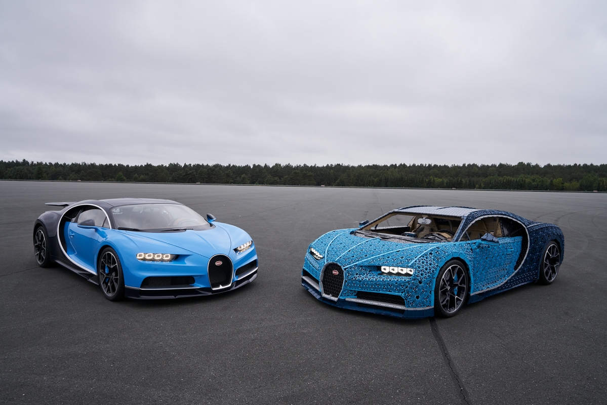 The real Bugatti Chiron on the left with the Lego model.