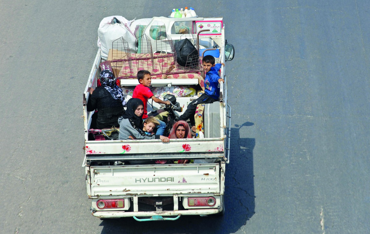 Residents of the Idlib province flee toward the Syrian Turkish border on September 10, 2018. AFP / Omar Haj Kadour  