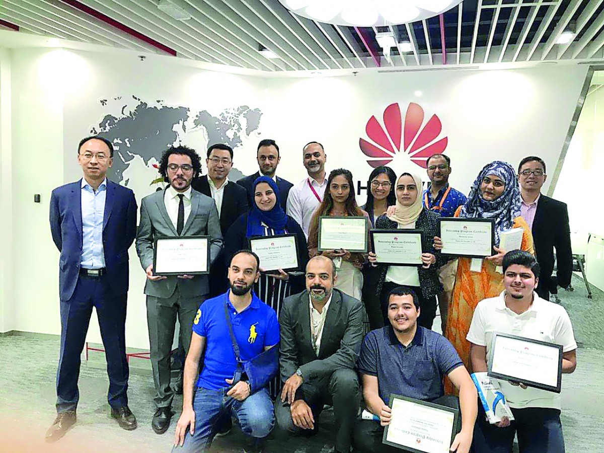 HBKU students with certificates after the internship program.