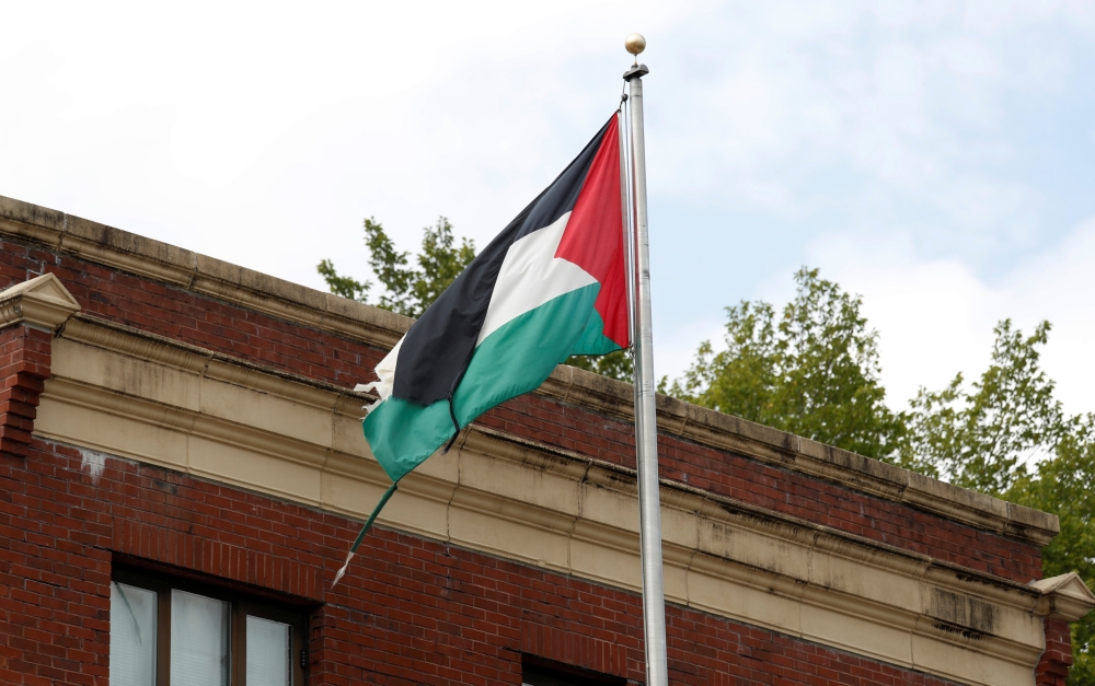 A tattered flag flies over the Palestine Liberation Organization (PLO) office two days after President Donald Trump's national security adviser John Bolton announced that the State Department would close the PLO office in Washington, U.S., September 12, 2