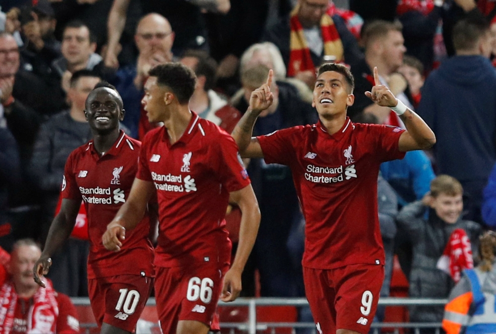  Liverpool's Roberto Firmino celebrates scoring their third goal Reuters/Phil Noble