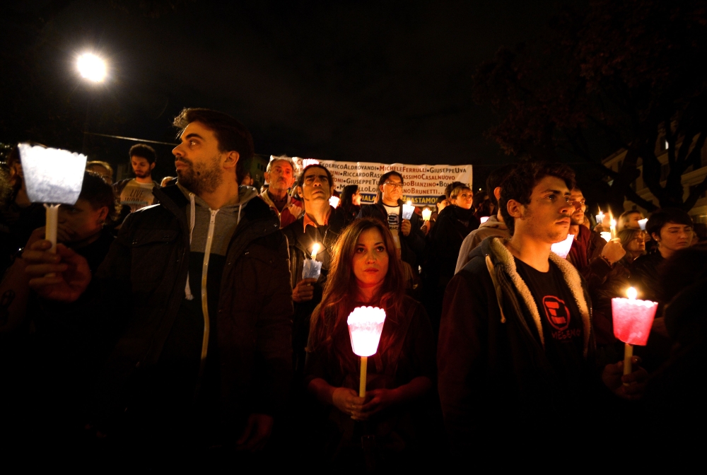 People hold candles in honor of Stefano Cucchi, a young Italian man who died in custody at Rome's Pertini prison hospital in 2010, during a demonstration in front of the italian Supreme Council of Judiciary on November 8, 2014 in Rome. The protest was org