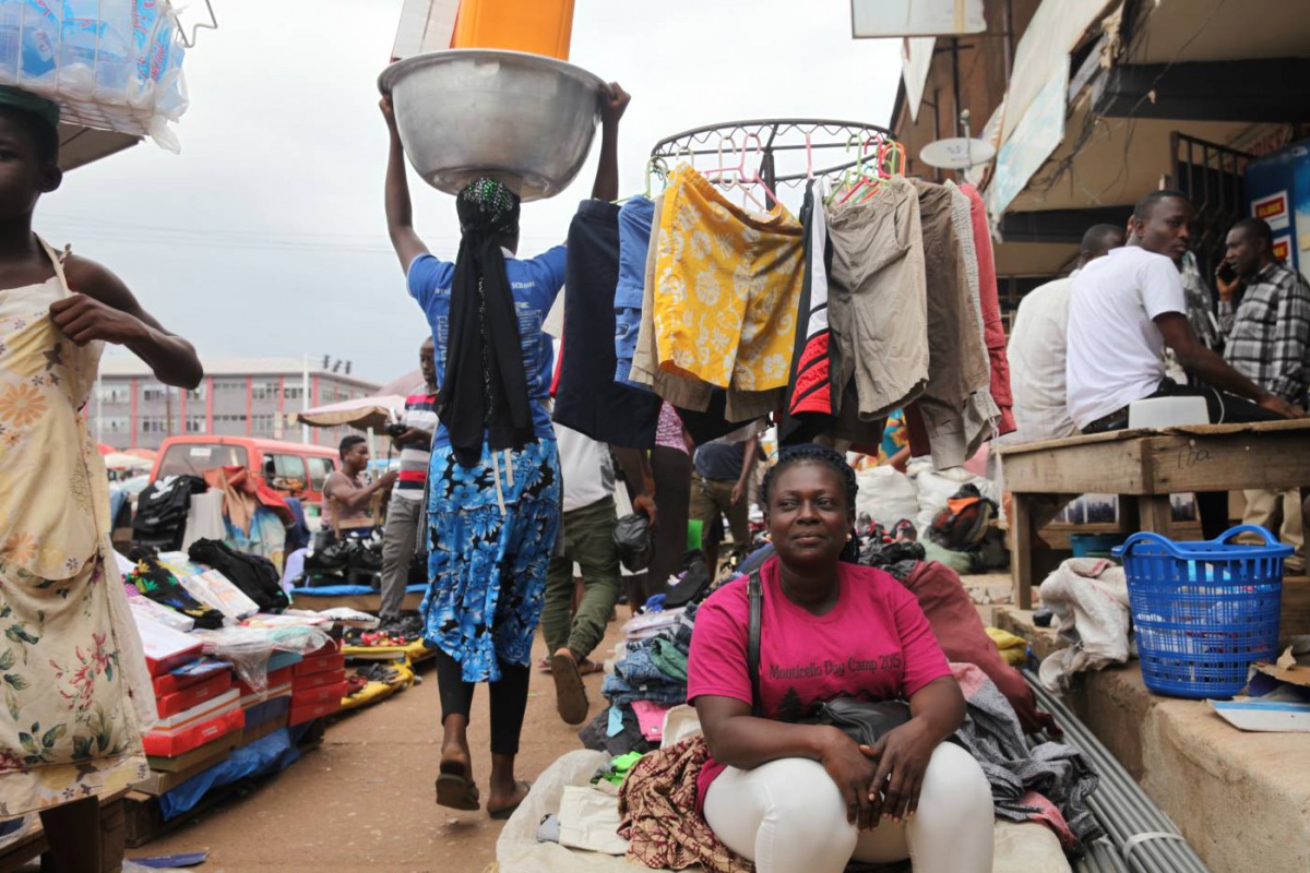 Akua Agyeawa poses for a portrait in front of her clothing stand in Madina, Ghana, July 3, 2018. Thomson Reuters Foundation/Nellie Peyton