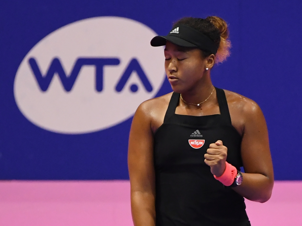 Naomi Osaka of Japan reacts during their women's singles semi-final tennis match against Camila Giorgi of Italy at the Pan Pacific Open tennis tournament in Tokyo on September 22, 2018. AFP / TOSHIFUMI KITAMURA