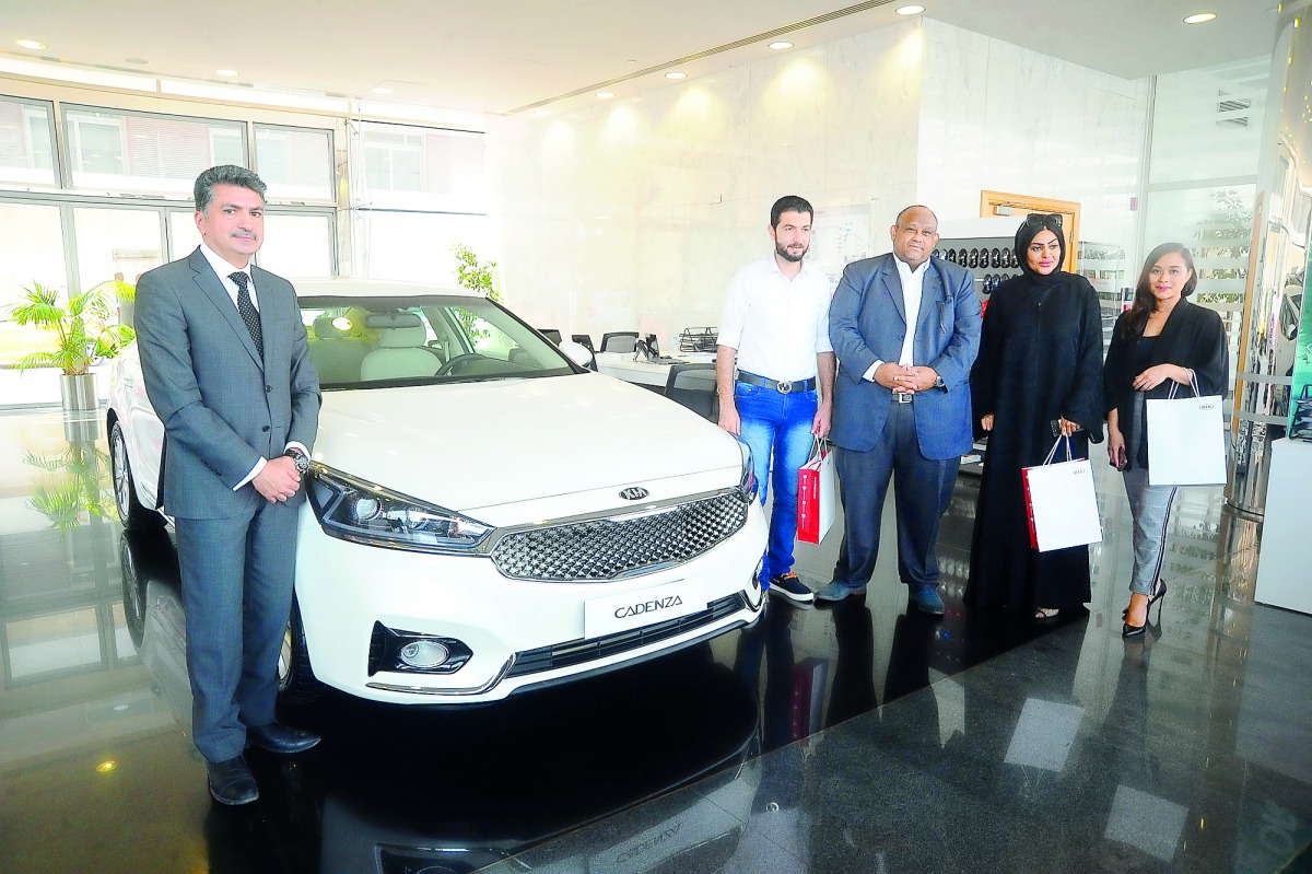 The handing over of the keys of the Kia Cadenza to the winner of the Fan Zone Raffle, Anas Alnemrat, at a ceremony held at the Al Sadd showroom of Kia Qatar. 