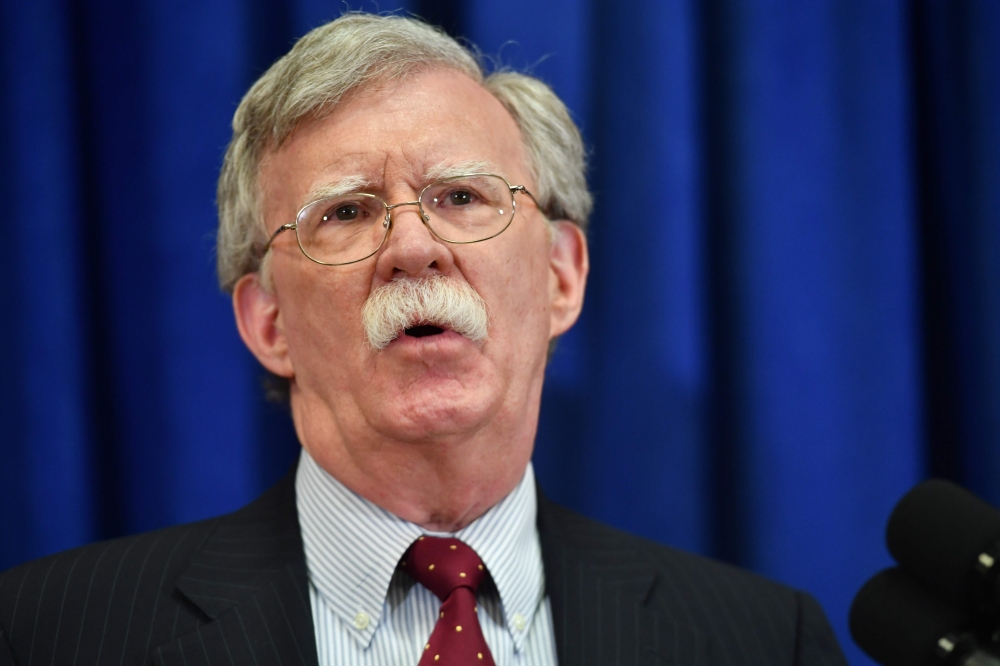 US national security adviser John Bolton (L) give a press briefing in New York on September 24, 2018 on the sidelines of the annual United Nations General Assembly. / AFP / Nicholas Kamm