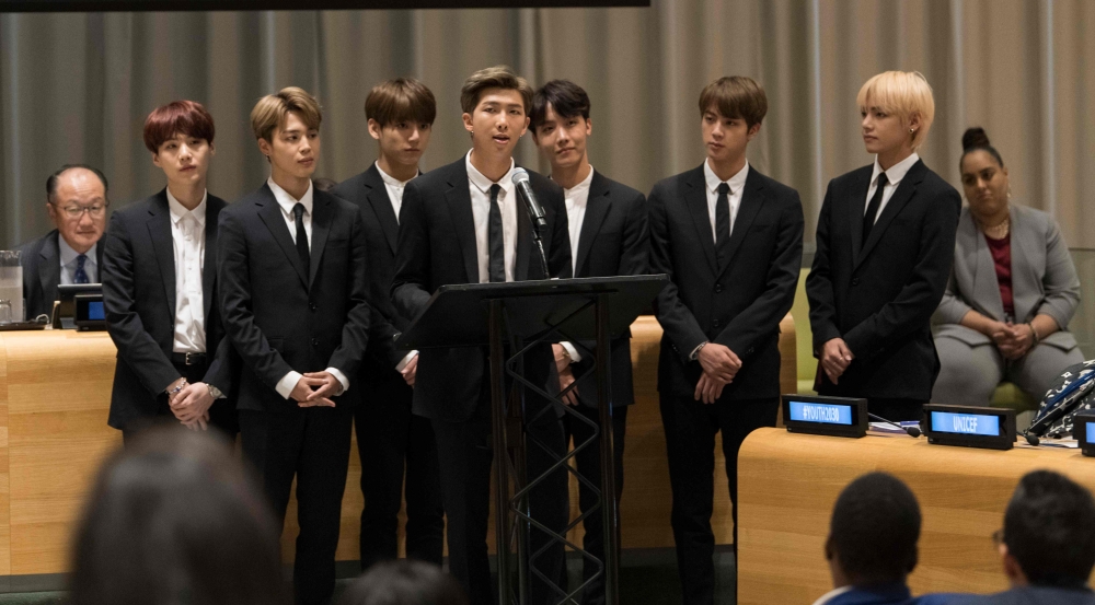 In this photo released by the United Nations, K-Pop band BTS speaks during a meeting focused on youth issues at the United Nations in New York on September 24, 2018. AFP PHOTO / UN/ Mark GARTEN
