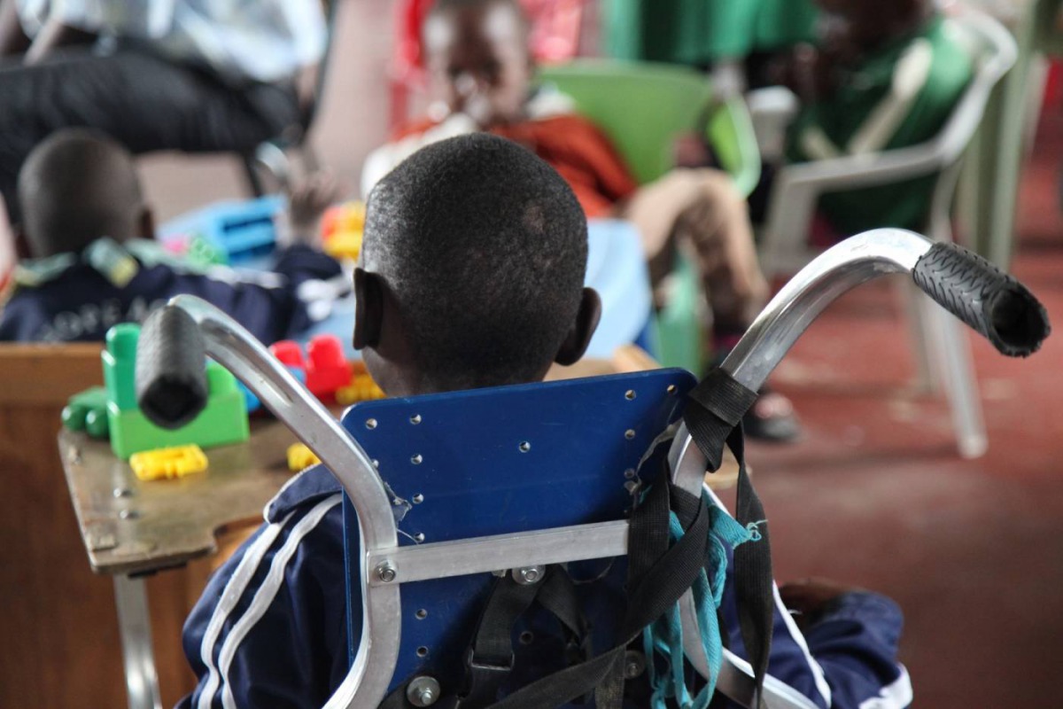 A child with cerebral palsy sits in wheelchair in an orphanage in eastern Nairobi, Kenya on Sept 26, 2018. Thomson Reuters Foundation/Nita Bhalla