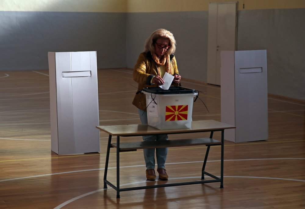 A woman casts her ballot for the referendum in Macedonia on changing the country's name that would open the way for it to join NATO and the European Union in Skopje, Macedonia September 30, 2018. REUTERS/Marko Djurica