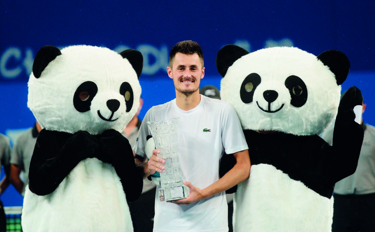 Bernard Tomic of Australia celebrates after winning the men's singles final against Fabio Fognini of Italy at the ATP Chengdu Open tennis tournament in Chengdu, in China's southwest Sichuan province on September 30, 2018. China OUT
/ AFP 