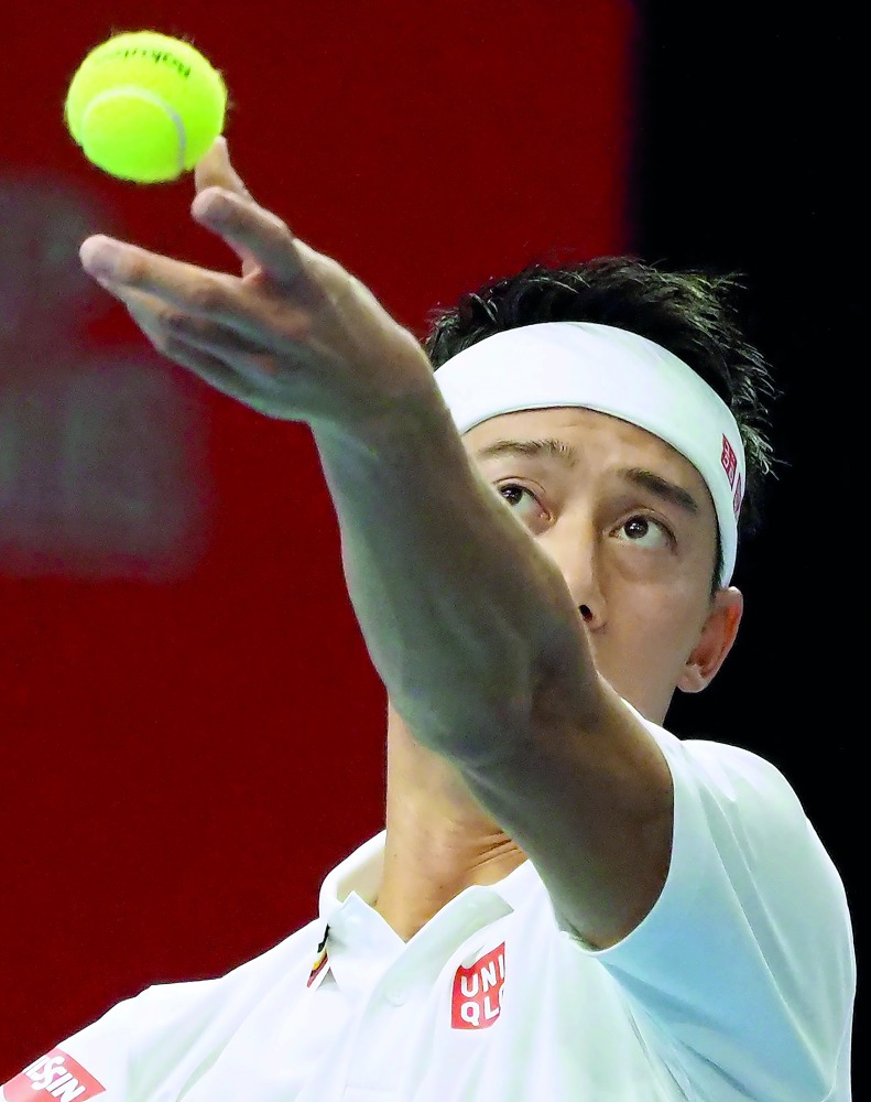Kei Nishikori of Japan serves during his men's singles second round match against France's Benoit Paire at the Japan Open tennis championships in Tokyo on October 3, 2018. AFP / Toshifumi Kitamura
