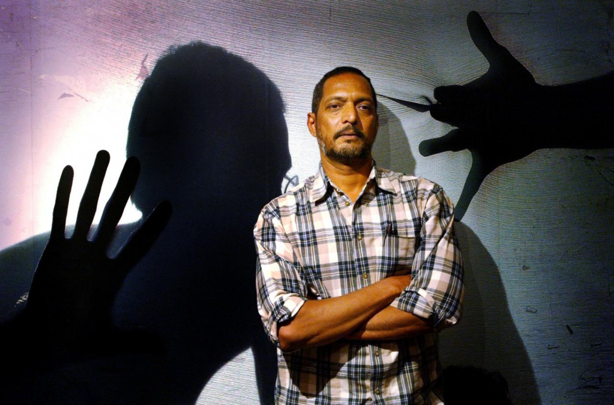 Bollywood star Nana Patekar, who plays the role of a policeman, poses for photographers during a media gathering to speak about his role in the Indian movie 
