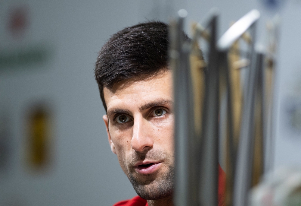 Novak Djokovic of Serbia attends a press conference after beating Borna Coric of Croatia in their men's singles final match at the Shanghai Masters tennis tournament on October 14, 2018. / AFP / Johannes EISELE
