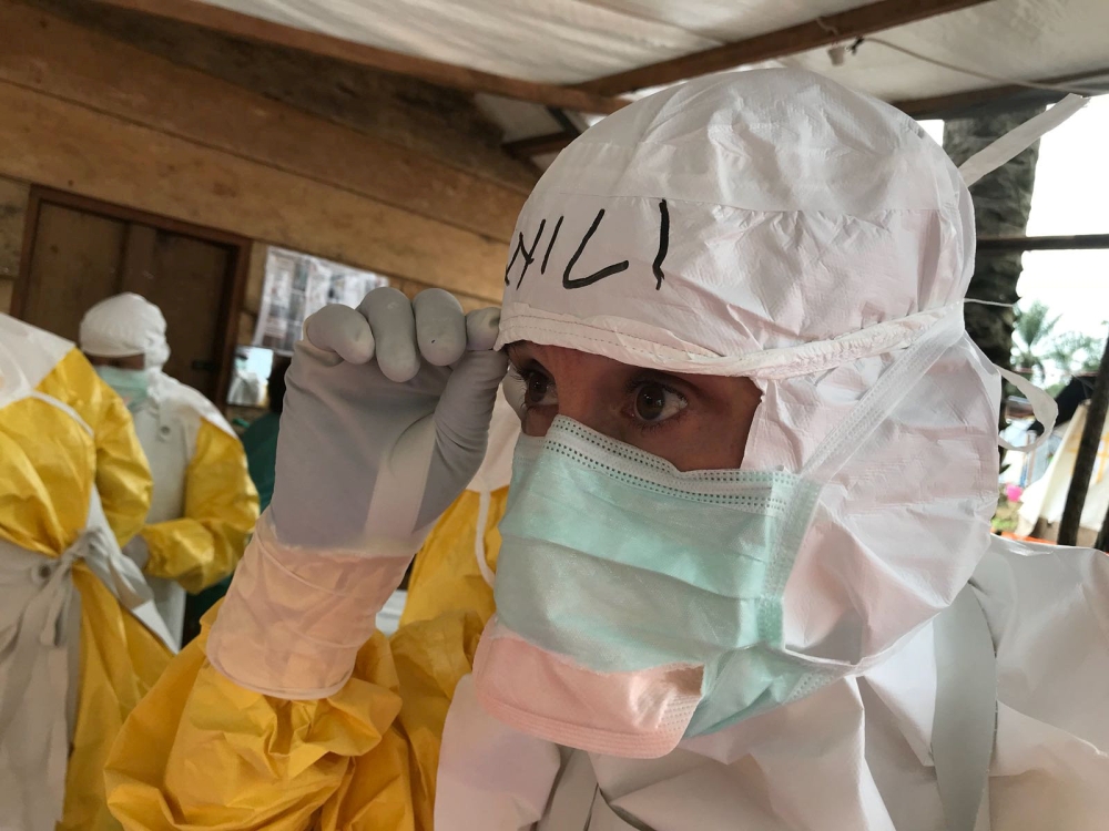World Health Organisation (WHO) Case Management Coordinator, Dr. William Fischer, checks his PPE as he prepares to administer an Ebola therapeutic drug to patients in Mangina, the Democratic Republic of the Congo August 28, 2018. Picture taken August 28, 