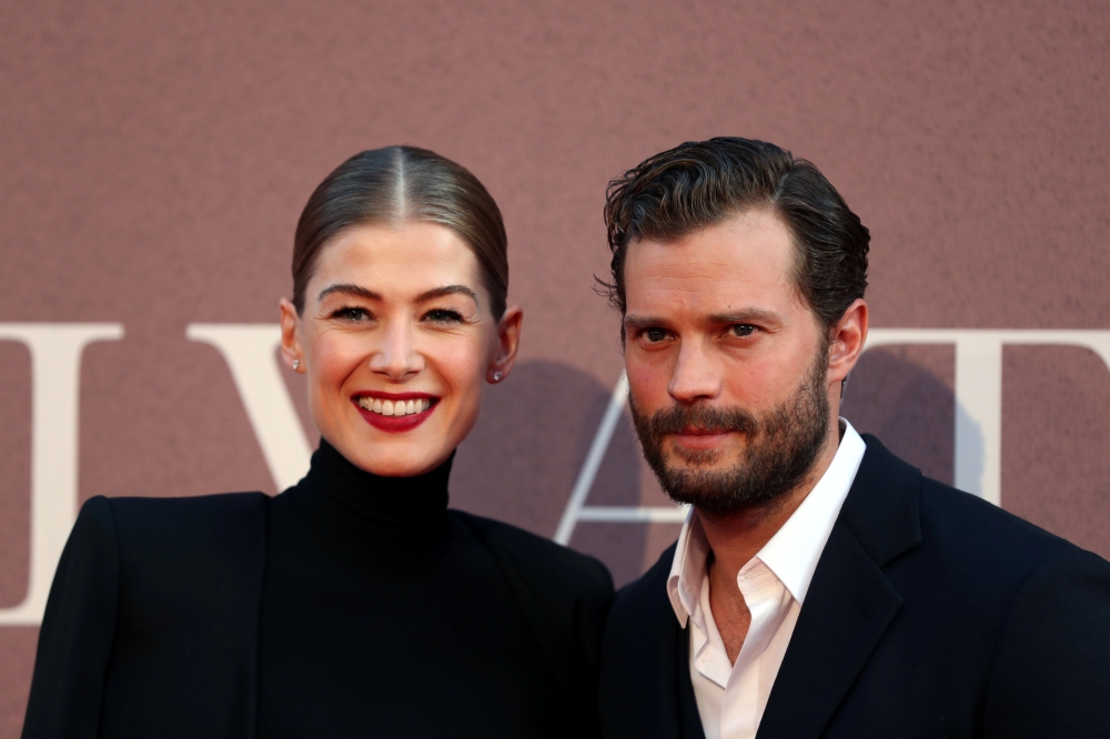 Actors Rosamund Pike and Jamie Dornan arrive at the European premiere of 