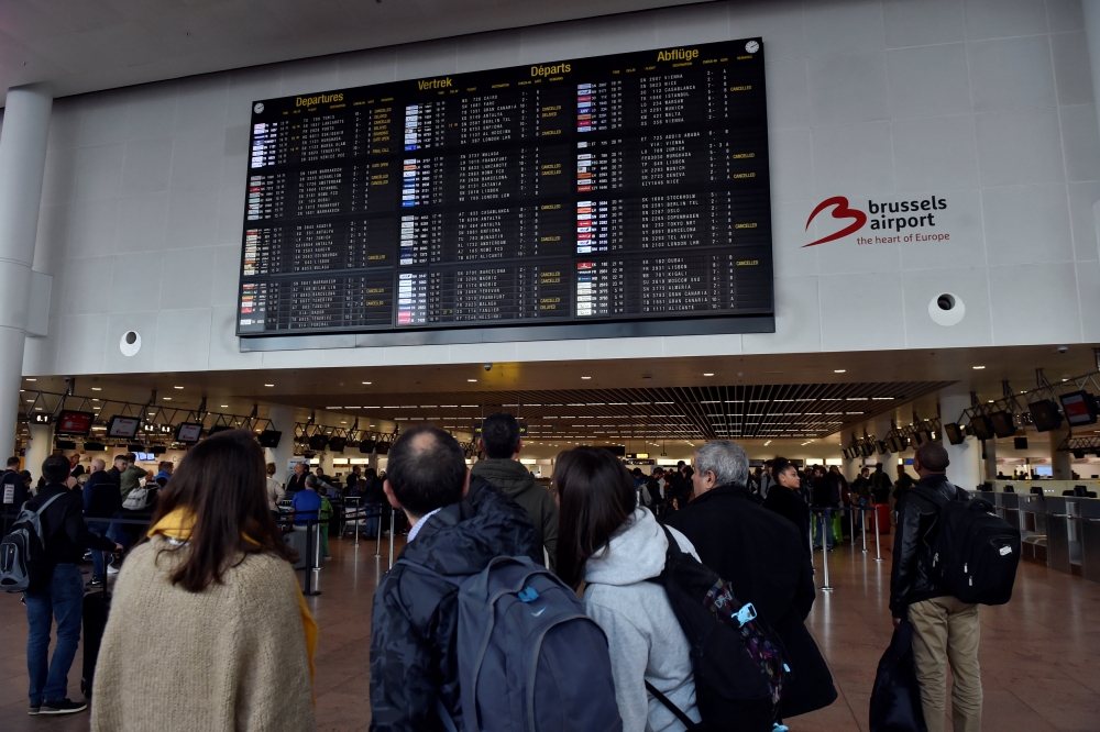 Passengers wait during a strike by Aviapartner baggage handlers at Zaventem international airport near Brussels, Belgium October 27, 2018. REUTERS/Eric Vidal
