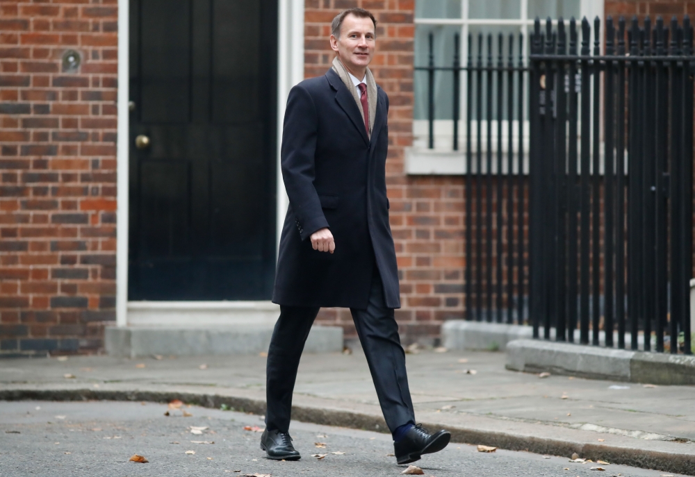 Britain's Foreign Secretary Jeremy Hunt arrives to attend the weekly meeting of the cabinet at 10 Downing Street in London on November 6, 2018. / AFP / Tolga AKMEN