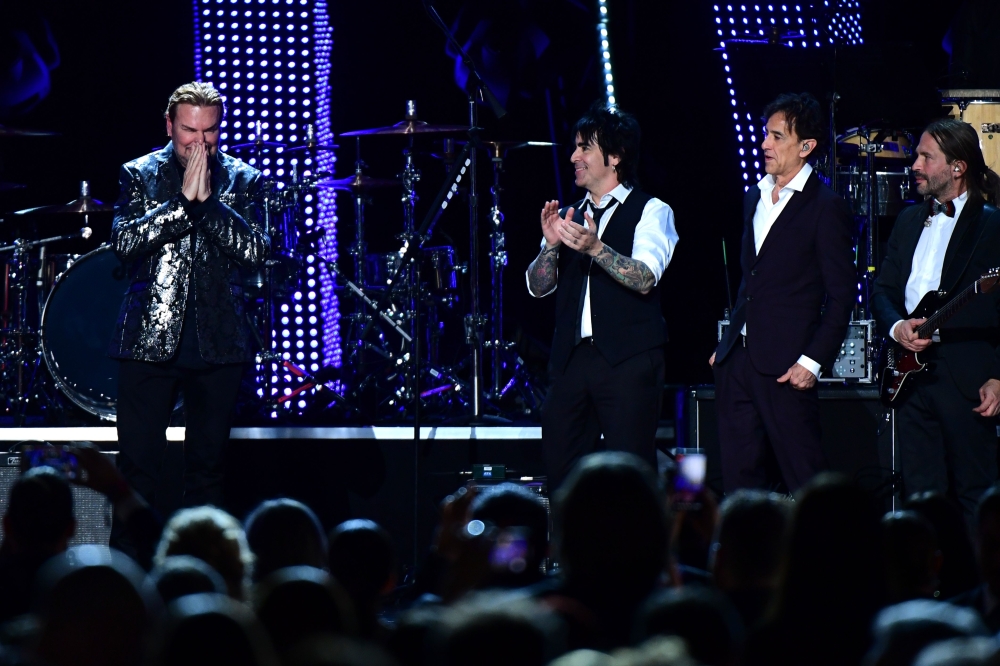 Members of Mexican rock group Mana Sergio Vallin, Juan Calleros, Fher Olvera and Alex Gonzalez speak onstage after receiving the 2018 Latin Recording Academy Person of the Year award at a gala in their honour in Las Vegas, Nevada, on November 14, 2018. AF