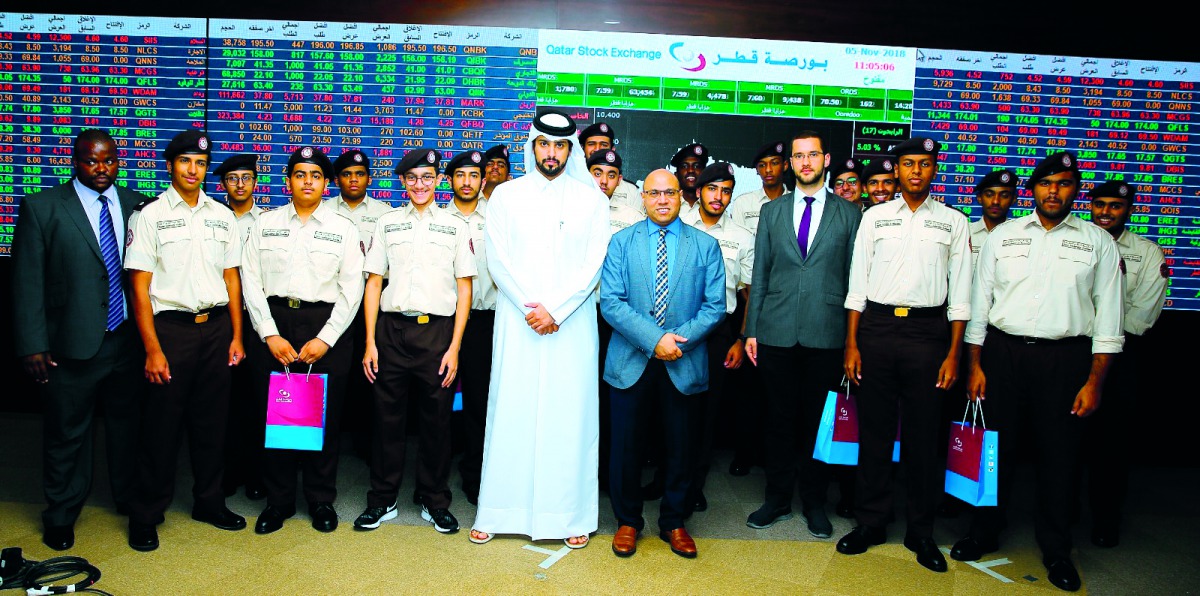Cadets from Qatar Leadership Academy (QLA), pose for a group photo during their visit to Qatar Stock Exchange.