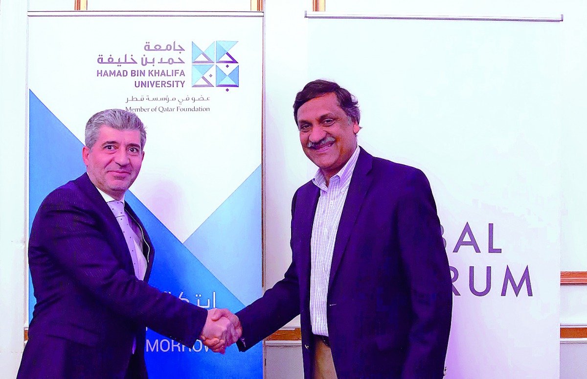 Dr Ahmad M. Hasnah, HBKU President, and Dr. Anant Agarwal, Founder and CEO of edX and MIT professor, shake hands after signing the agreement. 