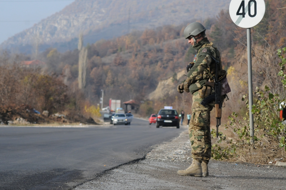 A member of the KFOR peacekeeping force patrols outside the village of Rudare near Mitrovica, Kosovo, November 23, 2018. Reuters/Laura Hasani
 