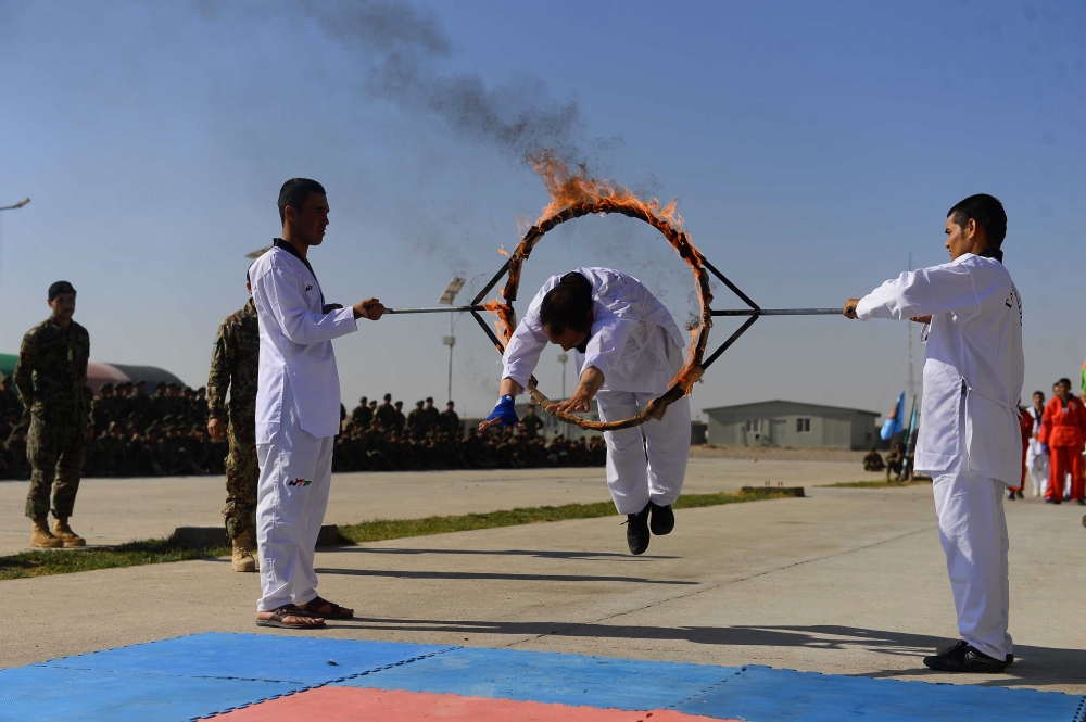 Afghan National Army (ANA) cadets demonstrate their skills during a graduation ceremony at the ANA training centre in Herat province on November 19, 2018. AFP / Hoshang Hashimi 