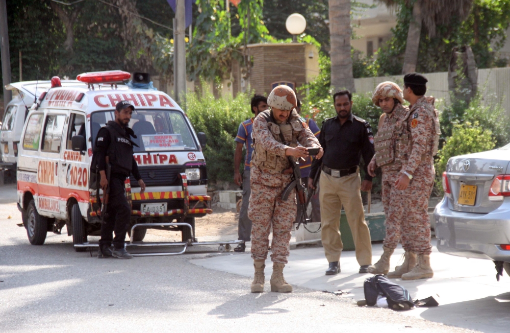 Pakistani security forces take measures outside the Chinese consulate after an armed attack in  Karachi on November 23, 2018. At least seven people were killed. (Sabir Mazhar/Anadolu Agency)