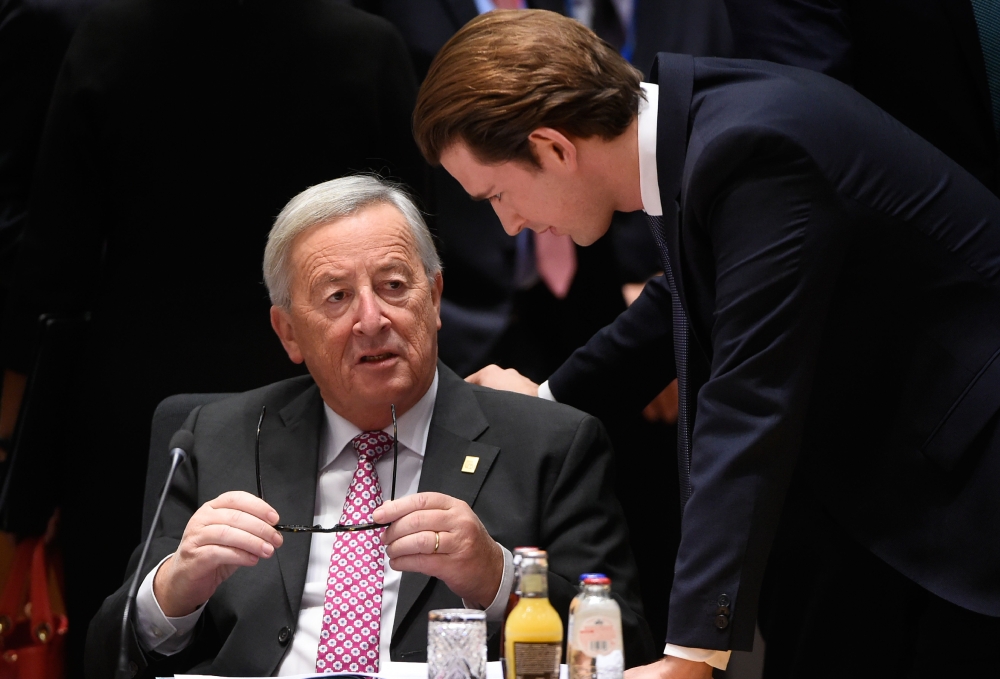 President of the European Commission Jean-Claude Juncker (L) chats with Austria's Chancellor Sebastian Kurtz before a special meeting of the European Council to endorse the draft Brexit withdrawal agreement and to approve the draft political declaration o