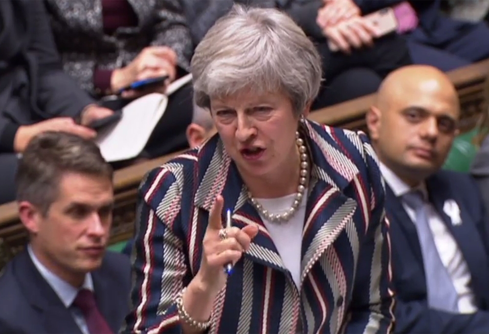 Britain's Prime Minister Theresa May answering a question from the Scottish National Party's (SNP) Ian Blackford after giving a statement to the House of Commons in London on November 26, 2018, to update parliament on the newly-agreed Brexit deal.  AFP  /