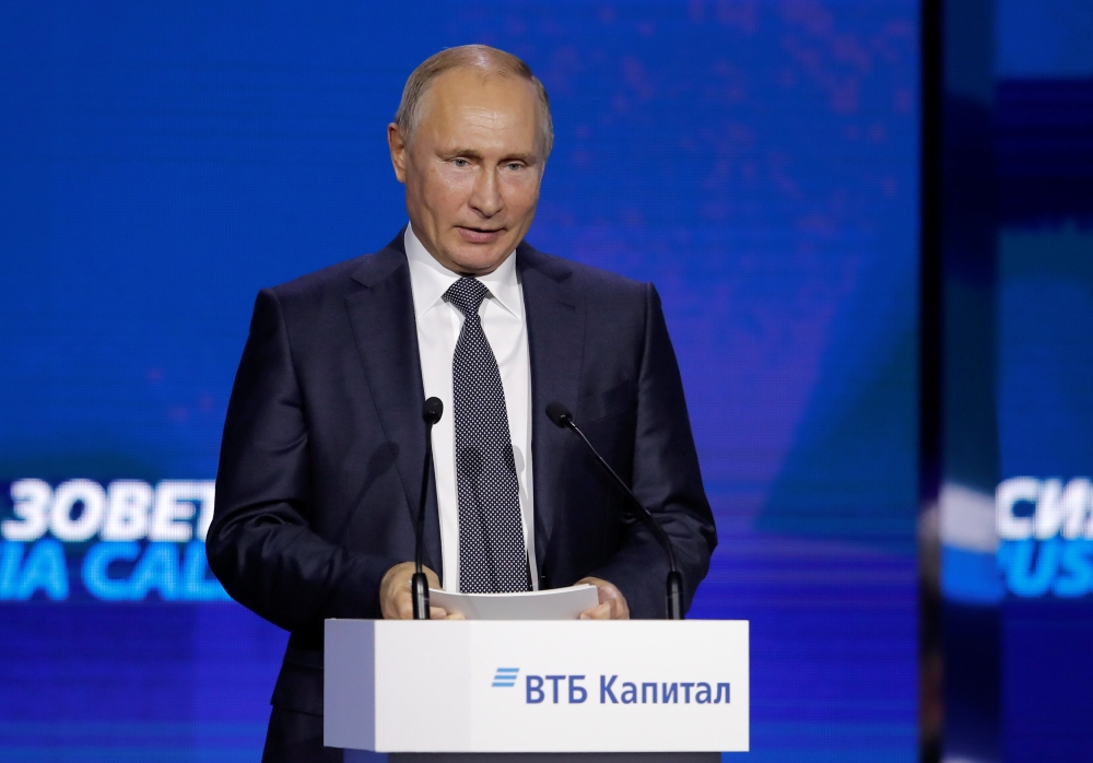 Russian President Vladimir Putin delivers a speech during a session of the VTB Capital Investment Forum 