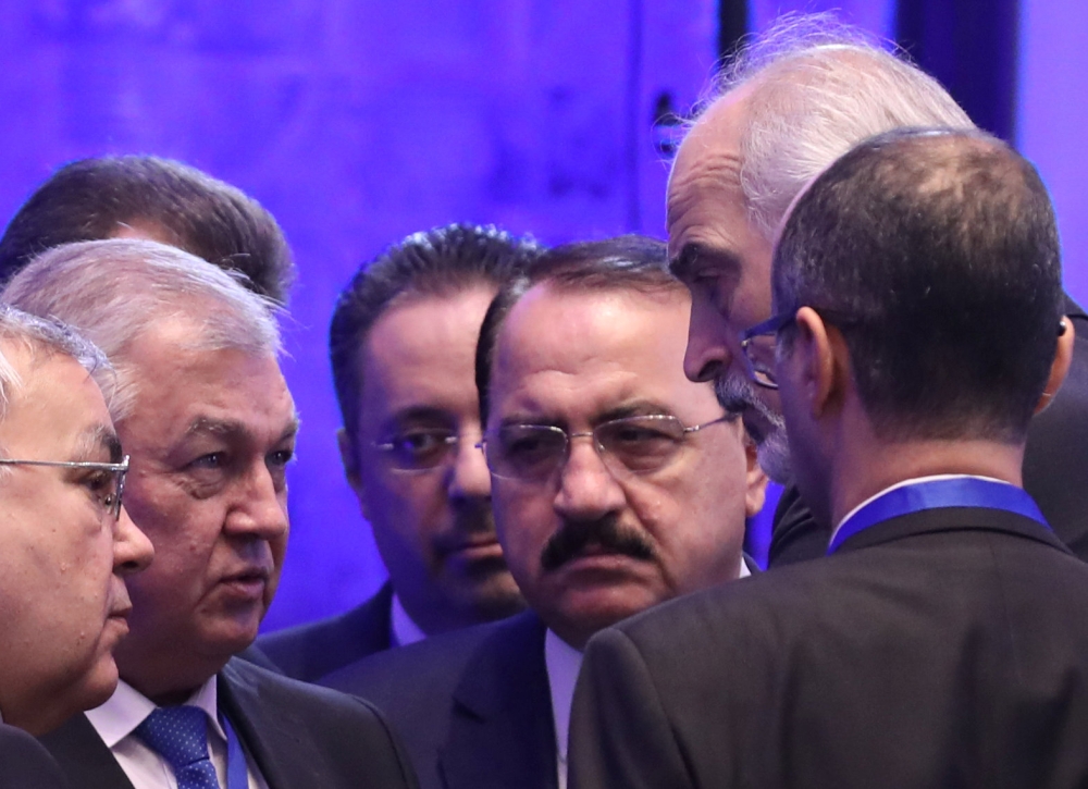 Russia's Special Envoy to Syria Alexander Lavrentiev speaks with Syria's U.N. ambassador Bashar al-Jaafari during Syria peace talks in Astana, Kazakhstan November 29, 2018. REUTERS/Mukhtar Kholdorbekov