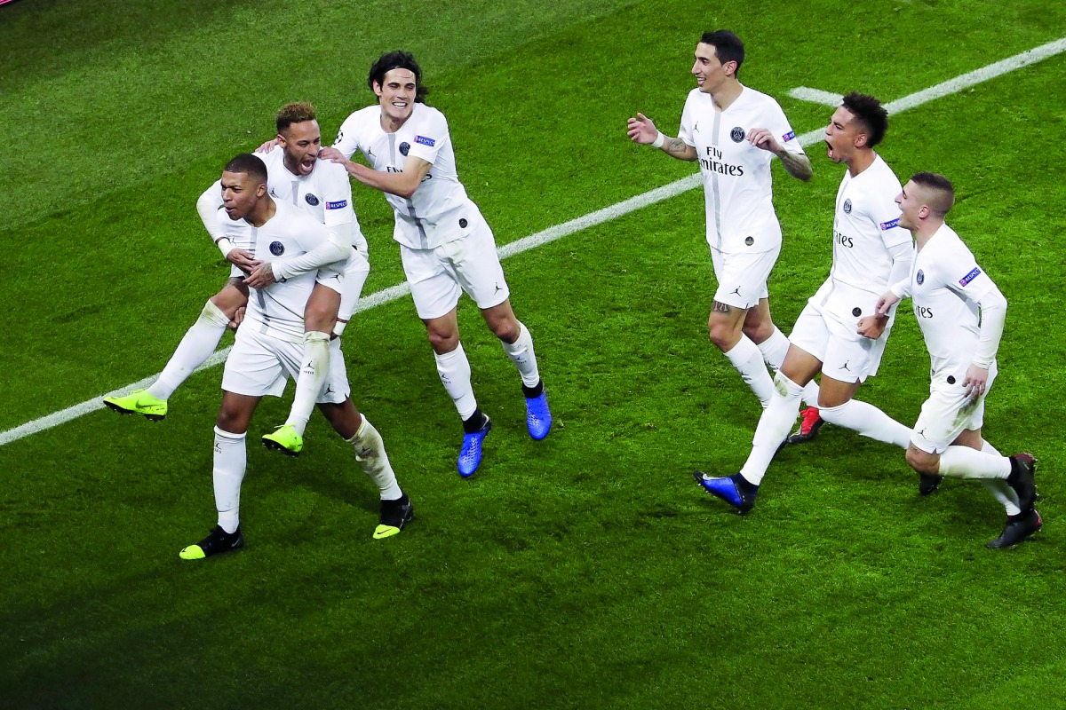 Paris Saint-Germain's Brazilian forward Neymar celebrates with Paris Saint-Germain's French forward Kylian Mbappe and teammates after scoring a goal during the UEFA Champions League Group C football match between Paris Saint-Germain (PSG) and Liverpool FC