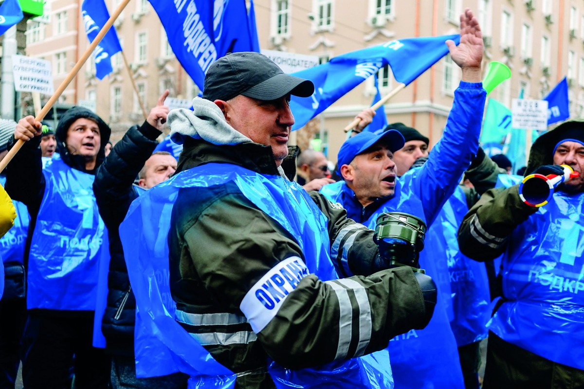 Workers and coal miners from Maritza-East, the largest coal-fired power station in Bulgaria, gesture and chant slogans during a demonstration in Sofia on November 29, 2018. Bulgaria, which gets over 40 percent of its energy from coal burning plants, will 
