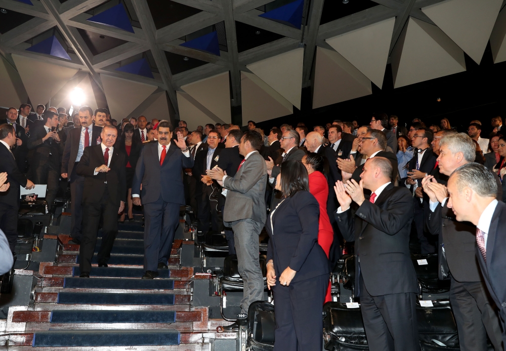 Turkish President Recep Tayyip Erdogan (C-L) and Venezuelan President Nicolas Maduro (C-R) arrive to attend the Venezuela-Turkey Business Forum in Caracas, Venezuela on December 03, 2018. (Cem Öksüz/Anadolu Agency) 