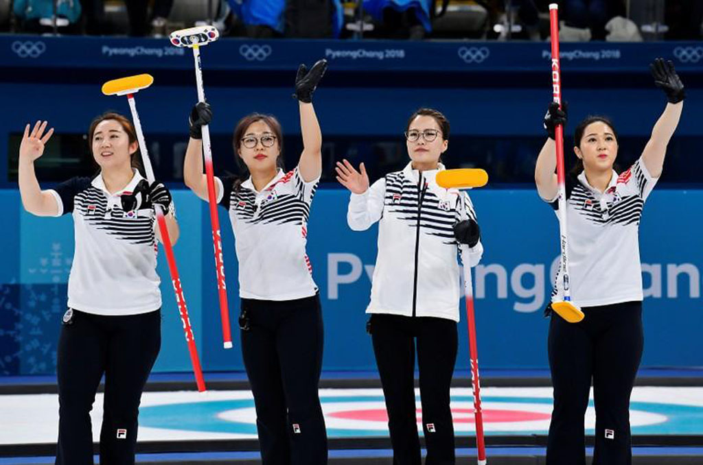 File photo of Kim Eun-jung, Kim Kyeong-ae, Kim Seon-yeong and Kim Yeong-mi of South Korea celebrate beating Sweden, February 19, 2018. REUTERS/Toby Melville/File Photo